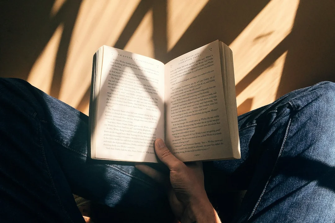 A reader holding an open book